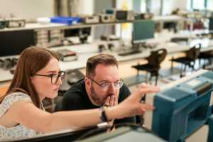 Engineering students using equipment