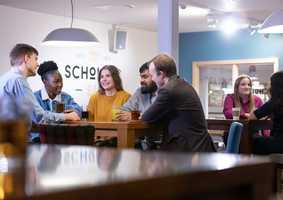 Research students socialising in scholars bar